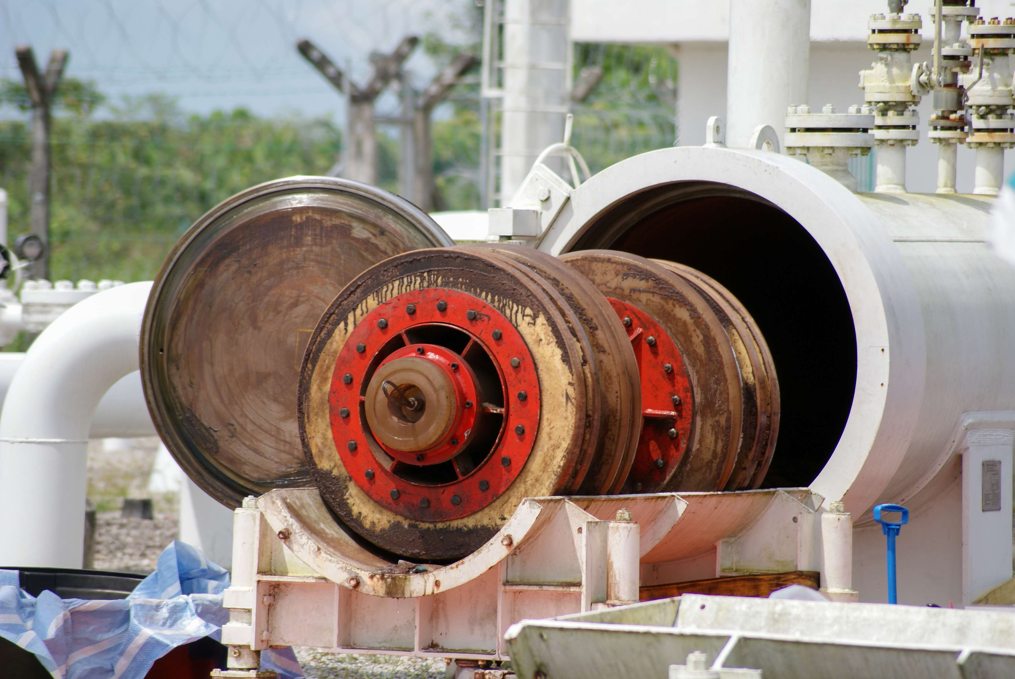 Image of a dirty pipeline cleaning tool at the receiver end of a pipeline.