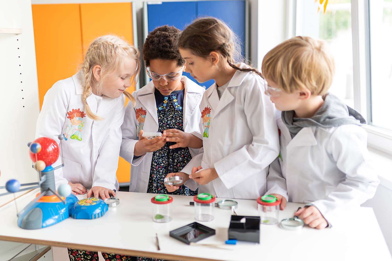 School kids having science class
