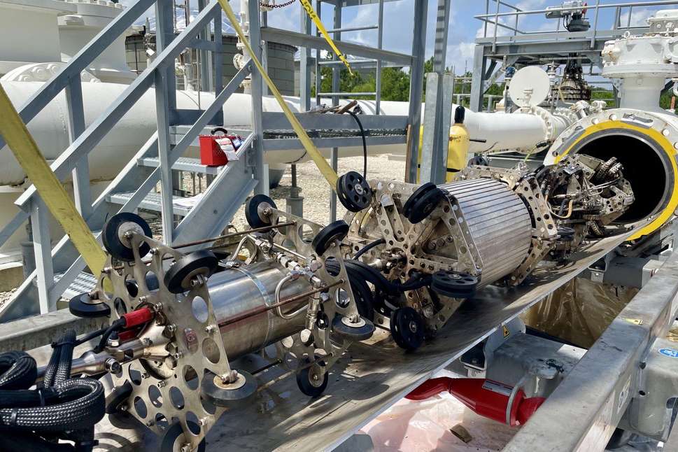 Tool setup for a robotic ultrasonic inspection of a dual-diameter pipeline.