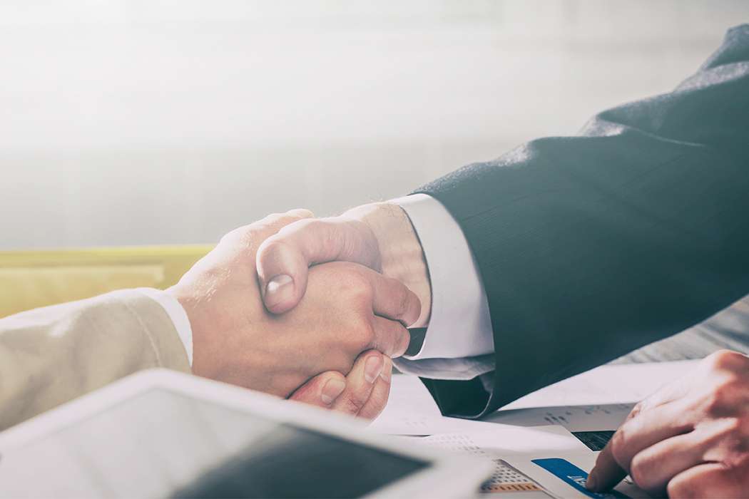 Two people shaking hands.