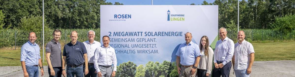 photovoltaics project group photo in front of launch sign