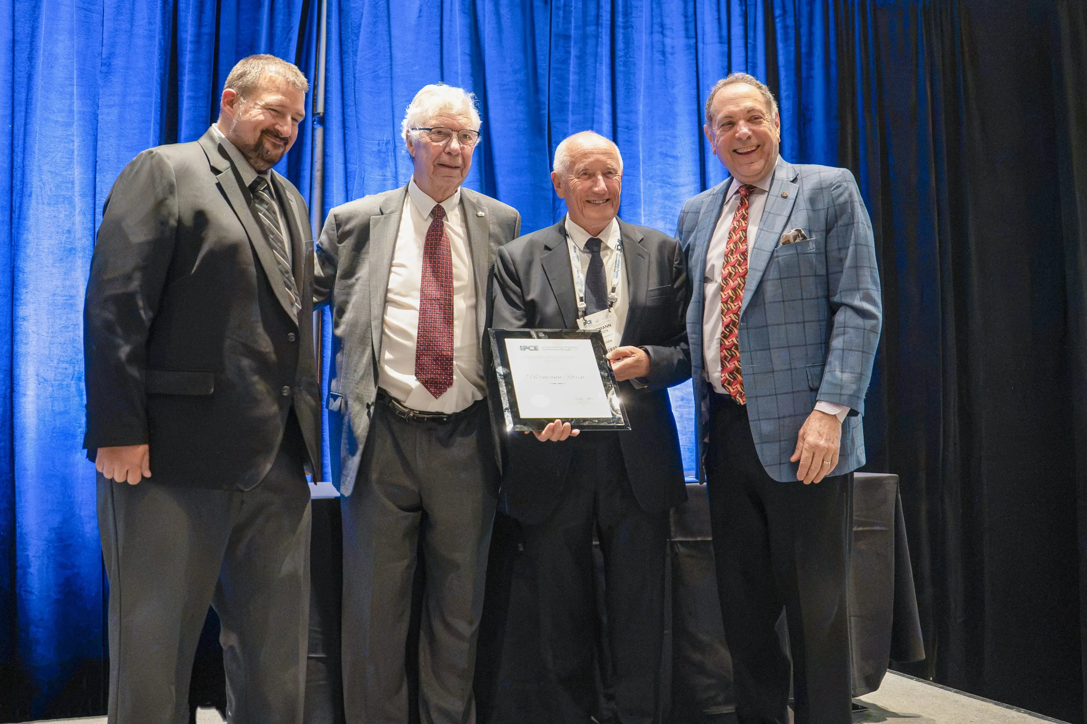 Hermann Rosen receiving the IPCE lifetime achievement honor at IPCE 2026 in Calgary, Canada.