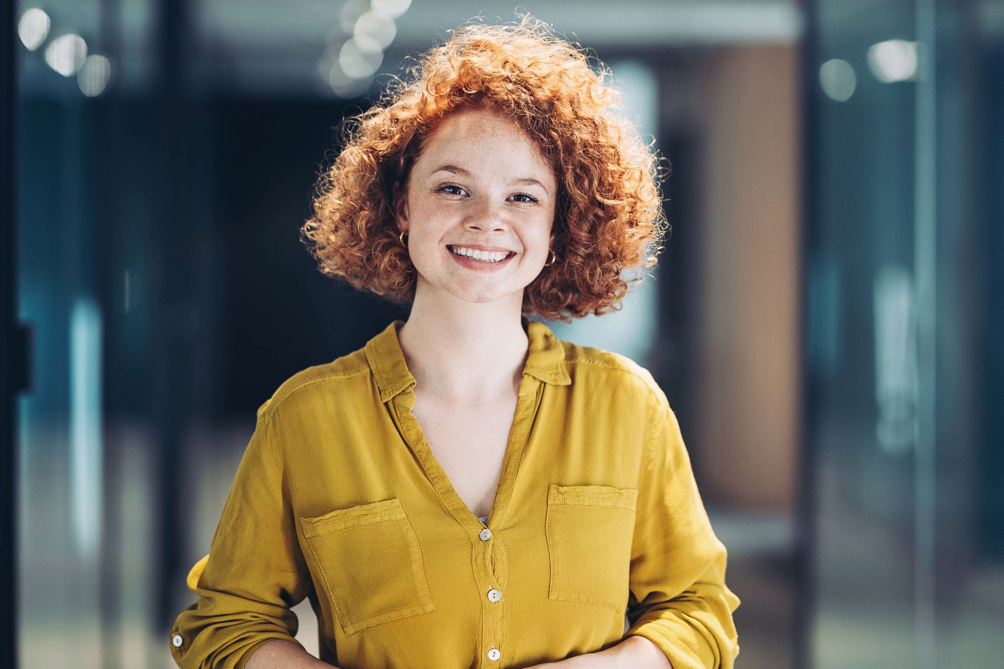 Young woman smiling at camera.