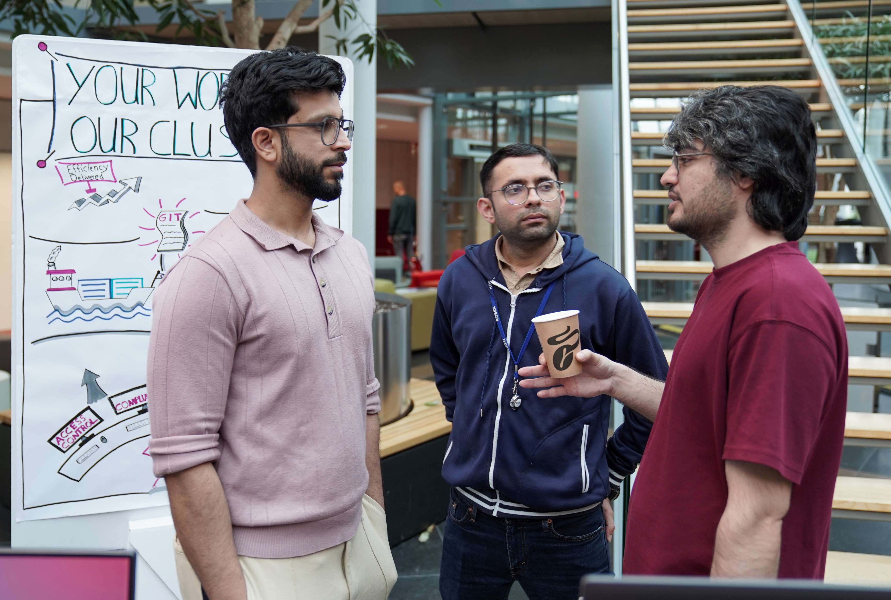 Employees learning about new developments at Creation Day.