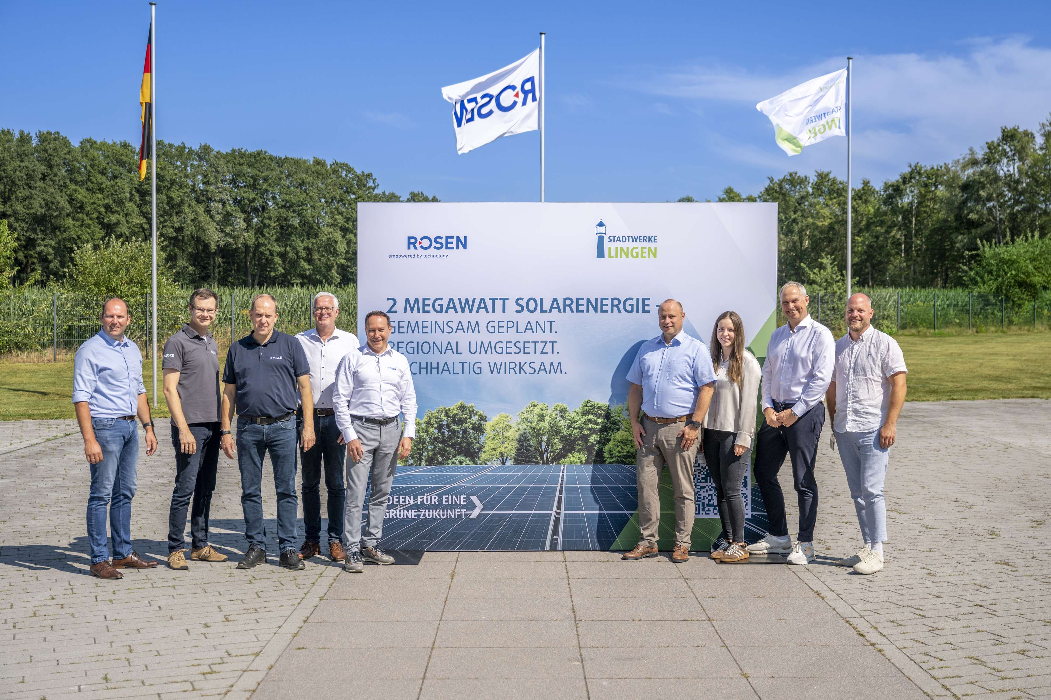 photovoltaics project group photo in front of launch sign
