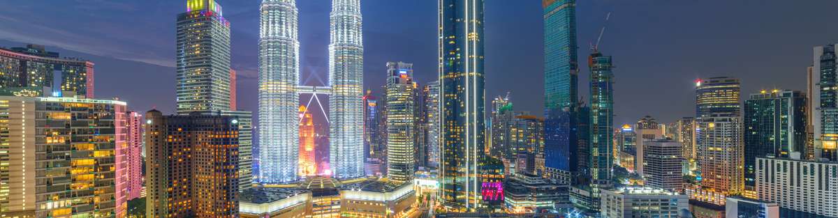 The KLCC Park and the Petronas Twin Towers at night.