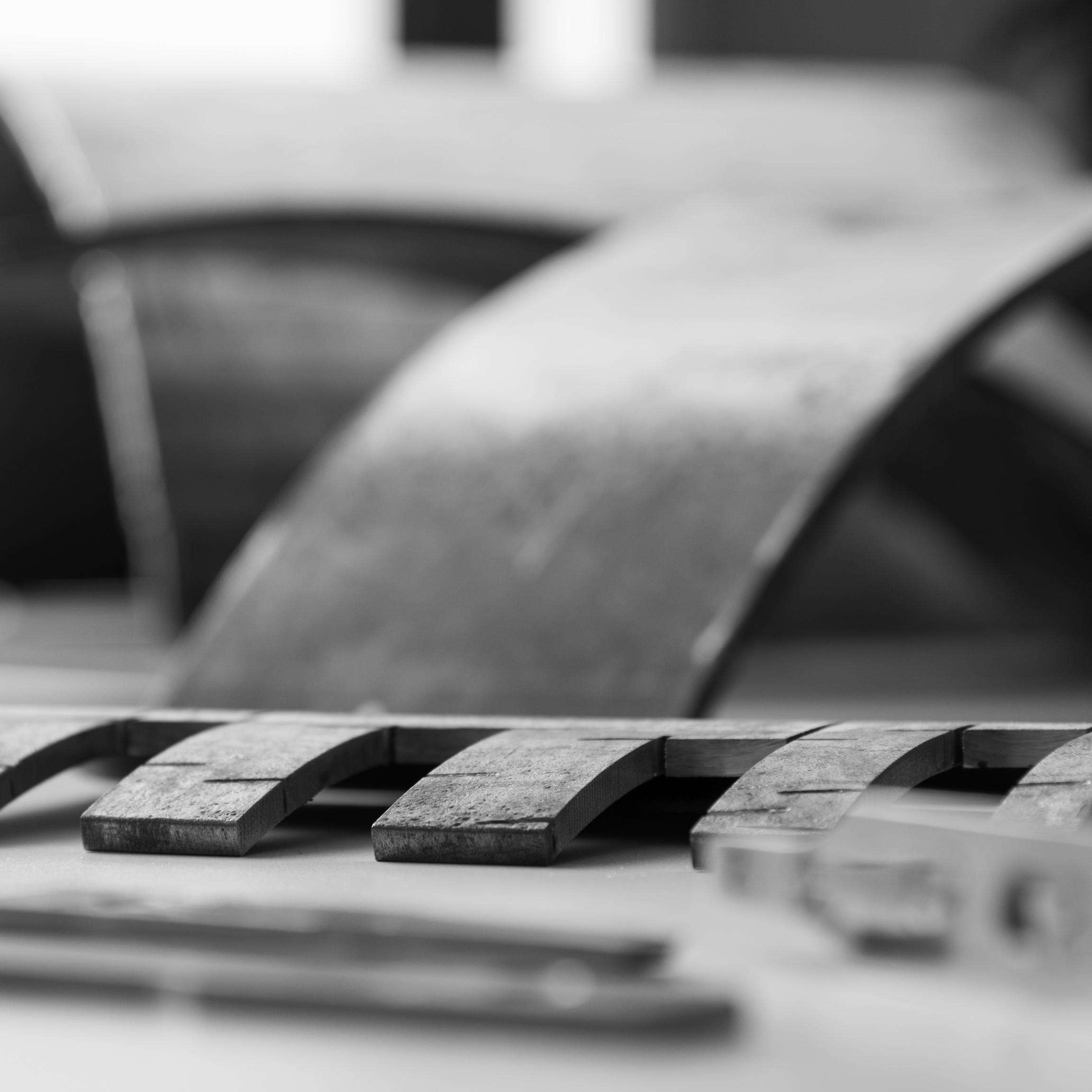 Black and white picture with parts of a pipeline.