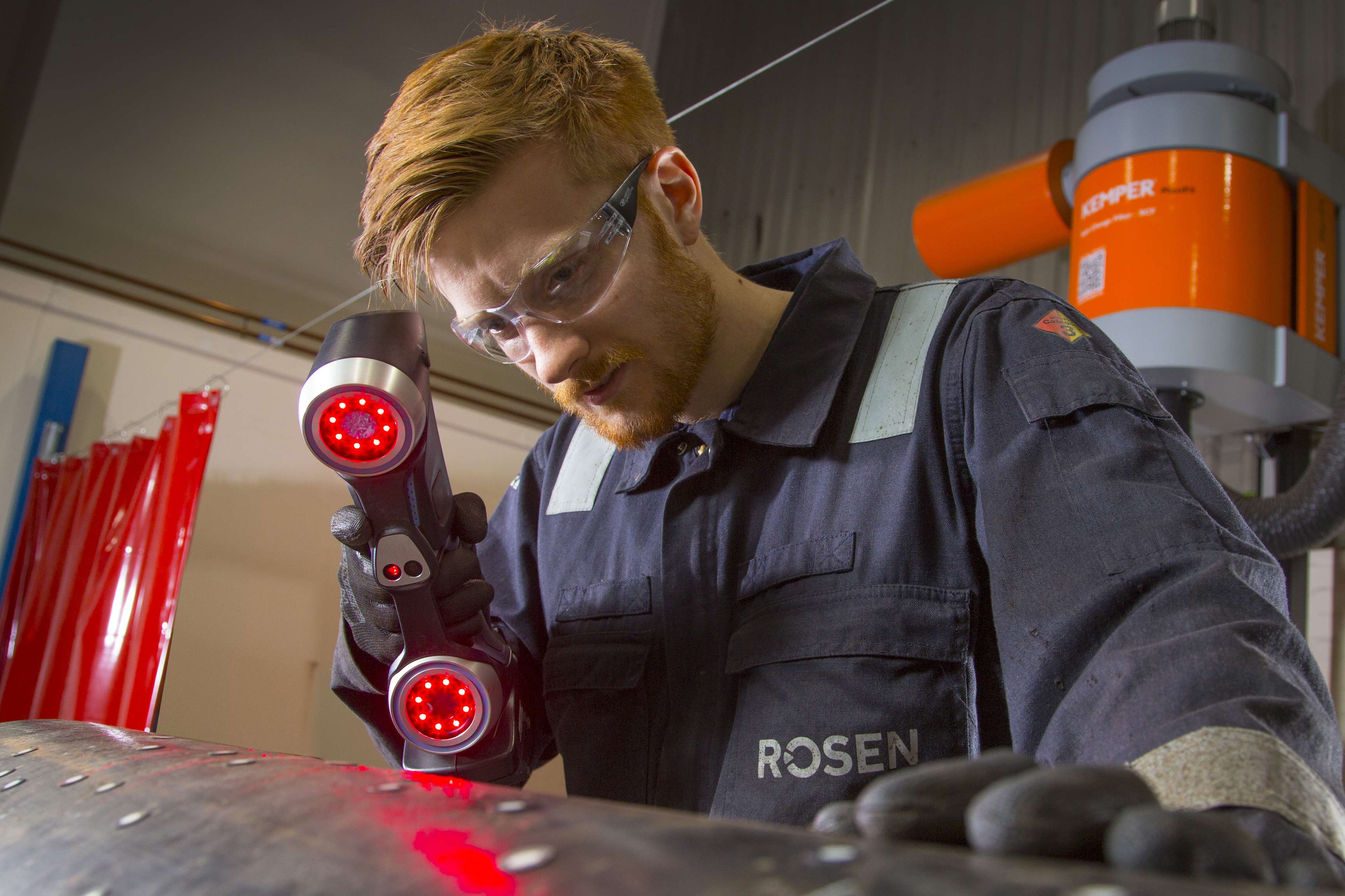 A ROSEN employee inspects a pipeline in our test facility.