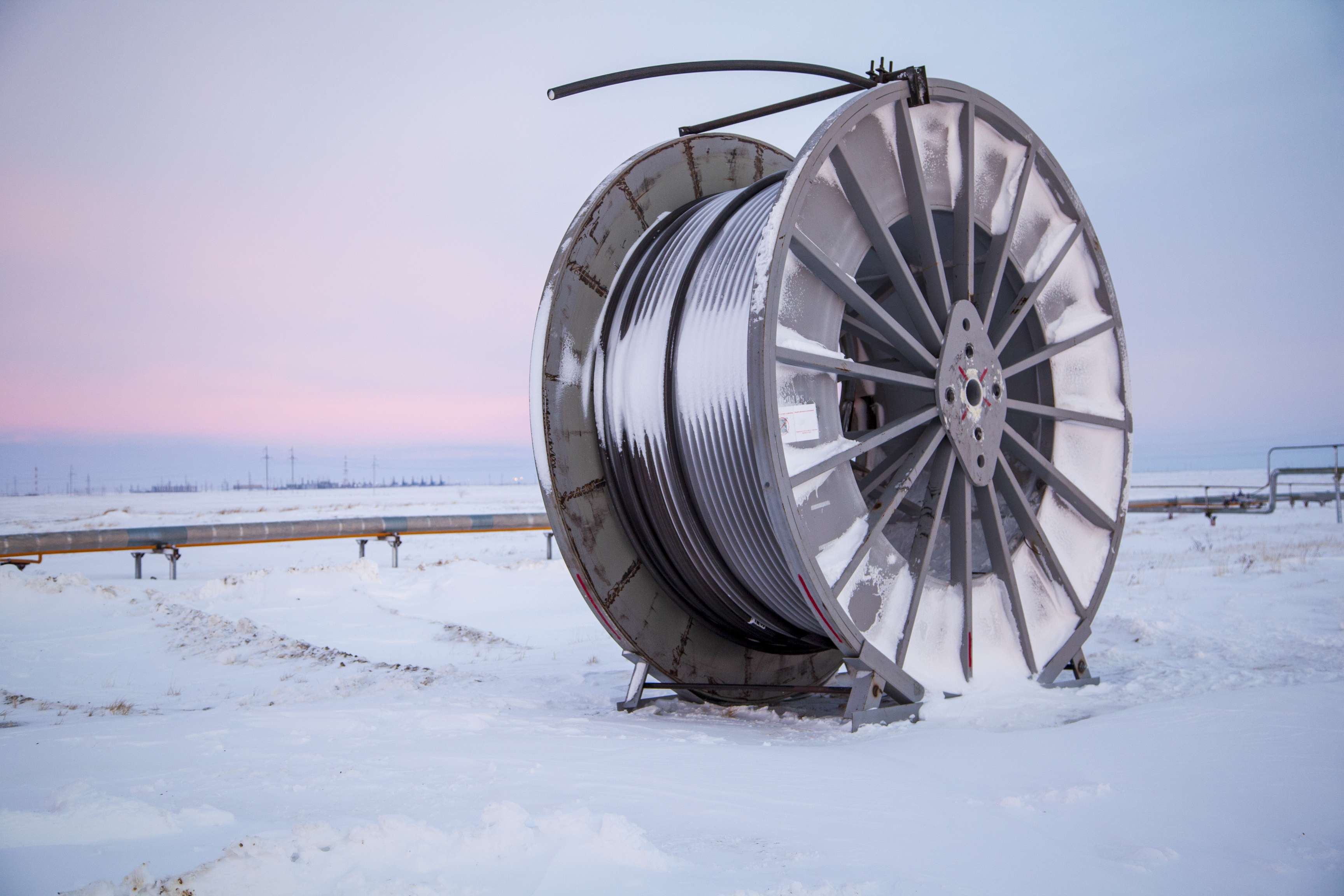 Three coiled tubing in a wintery background.