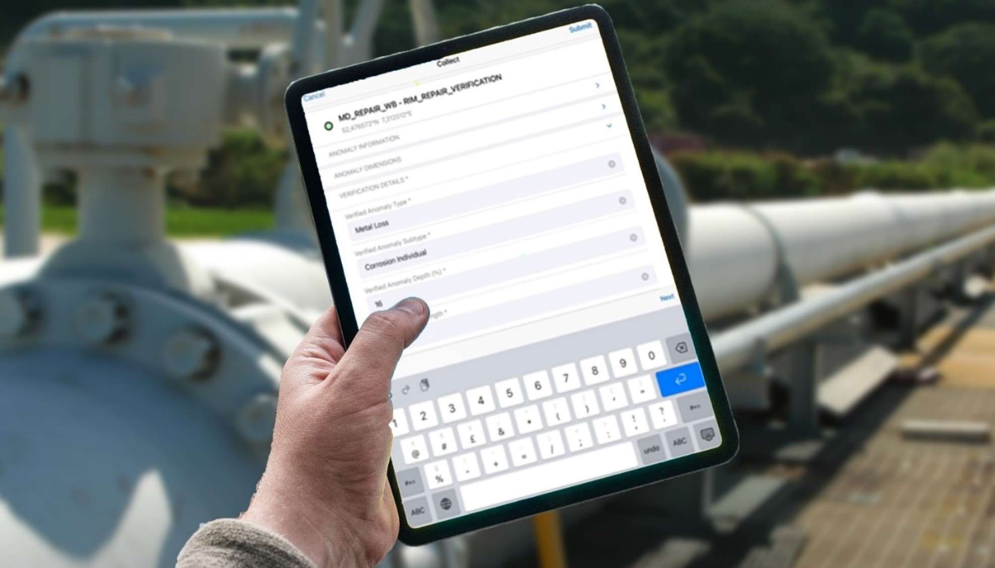 Hand holding a tablet that shows NIMA's field capture app with pipeline asset in the background