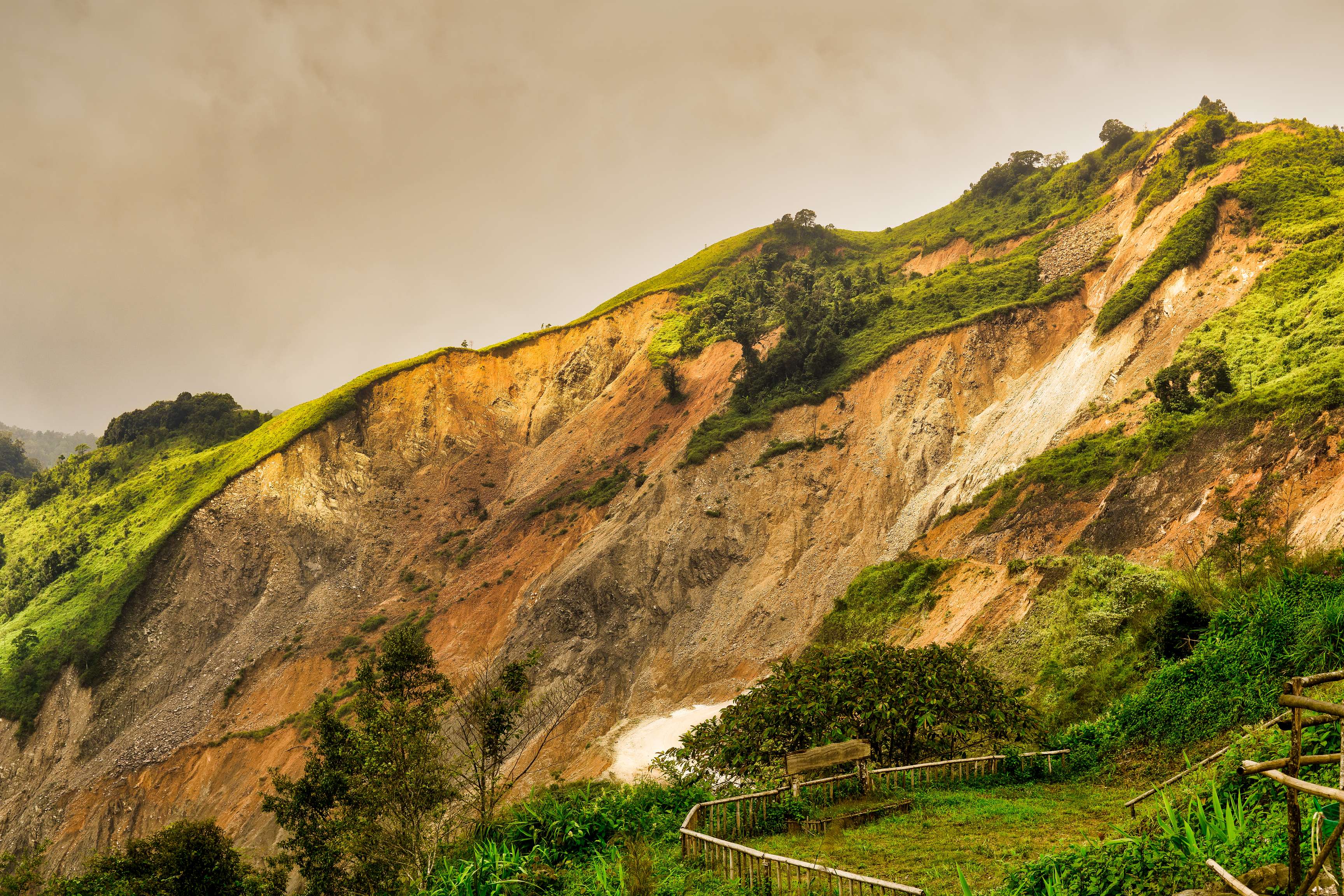 Image of the side of a mountain showing a past landslide.
