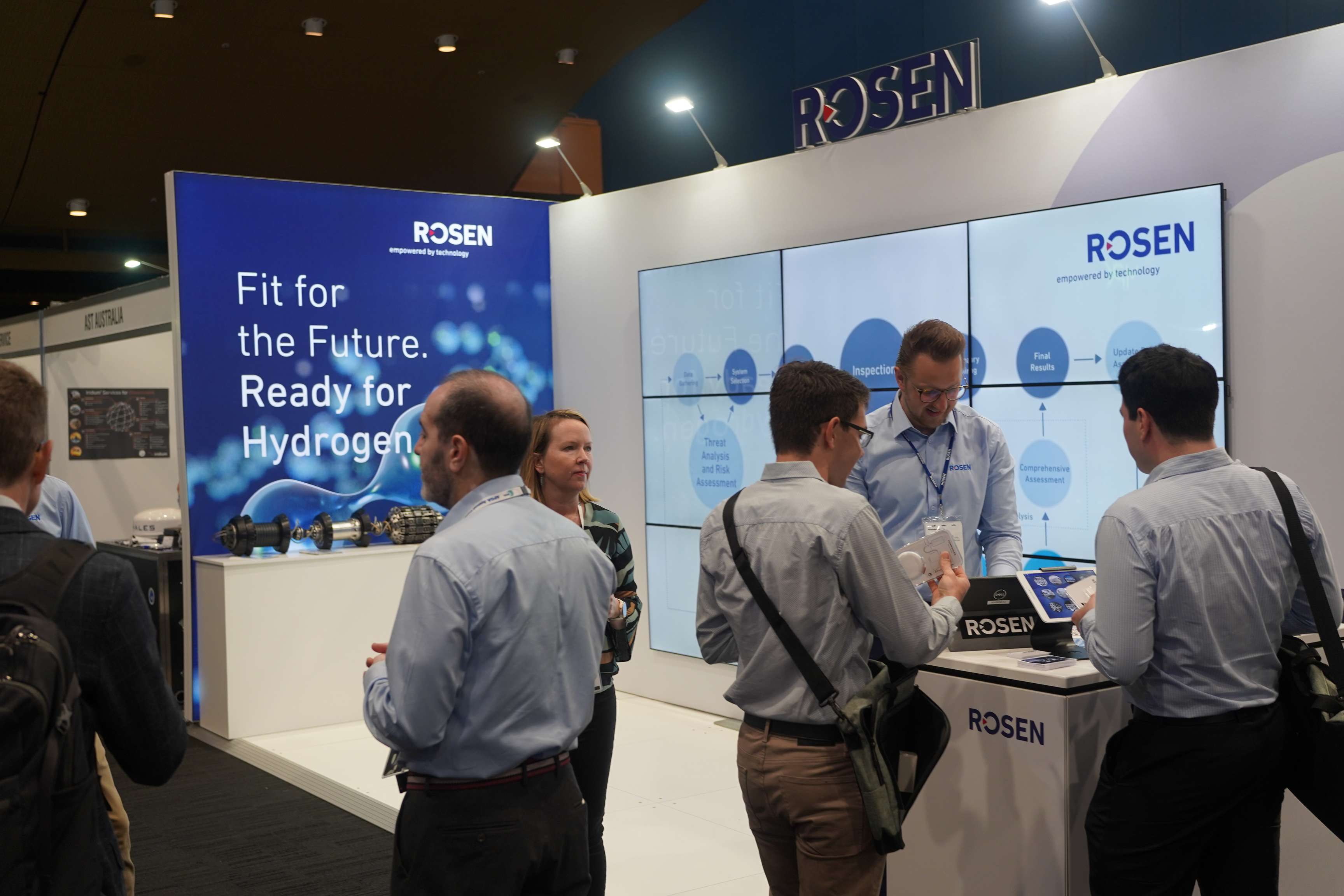 Picture of booth with people at exhibition