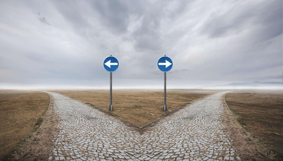 Path that divides into two parts with signs pointing in each direction.
