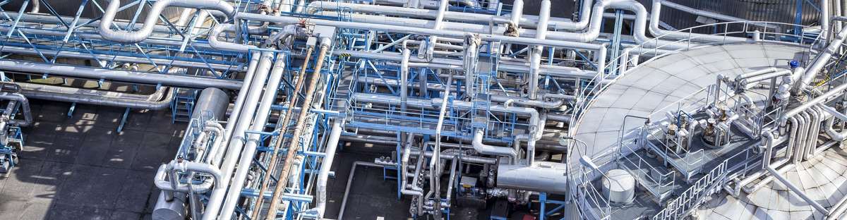 Bird's eye view of a blue-gray piping system and a tank on the right side.