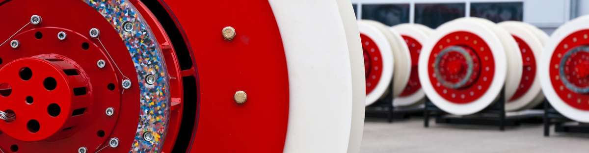 Close up of a cleaning tool with other blurry cleaning tools in the background.