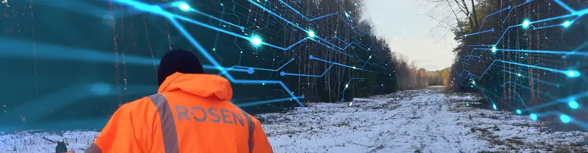 ROSEN employee making cathodic protection check in snowy landscape with data vizualisation in background