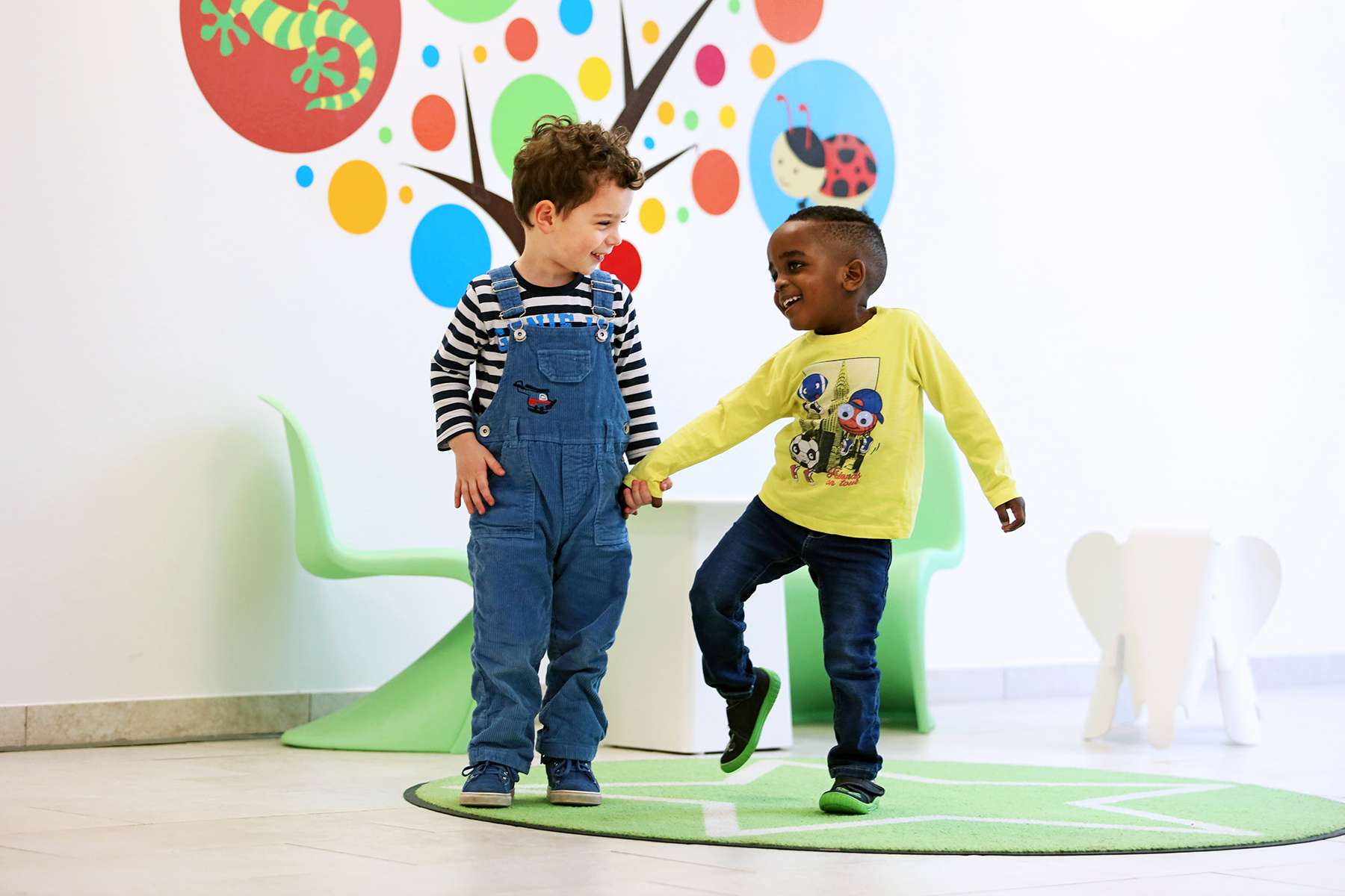Two kindergarten children playing together