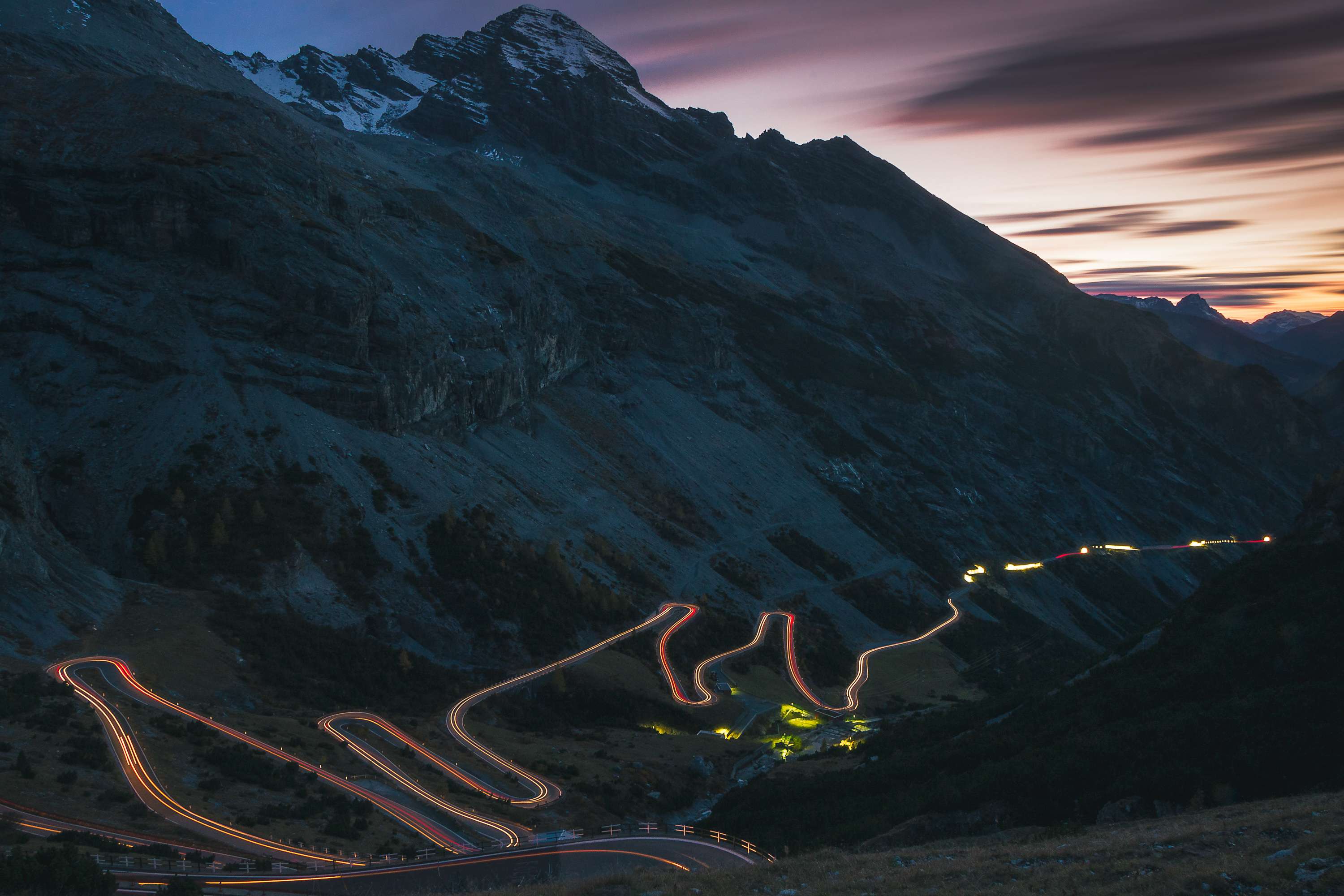 Mountain valley with lit up pipeline route through the valley.