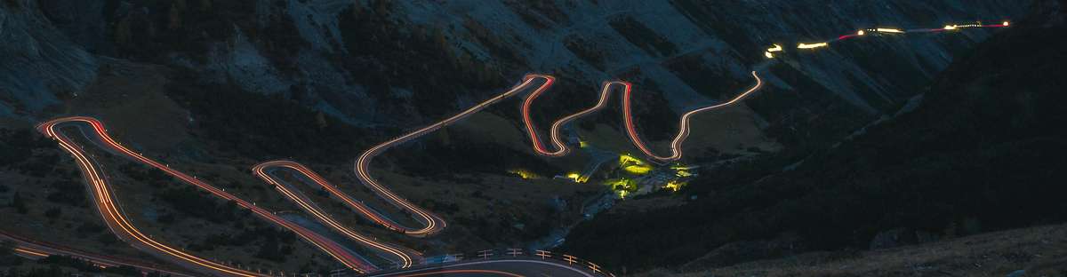 Mountain valley with lit up pipeline route through the valley.