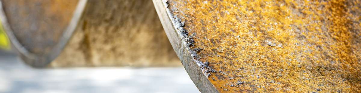 Close up of two pipelines with internal corrosion. 