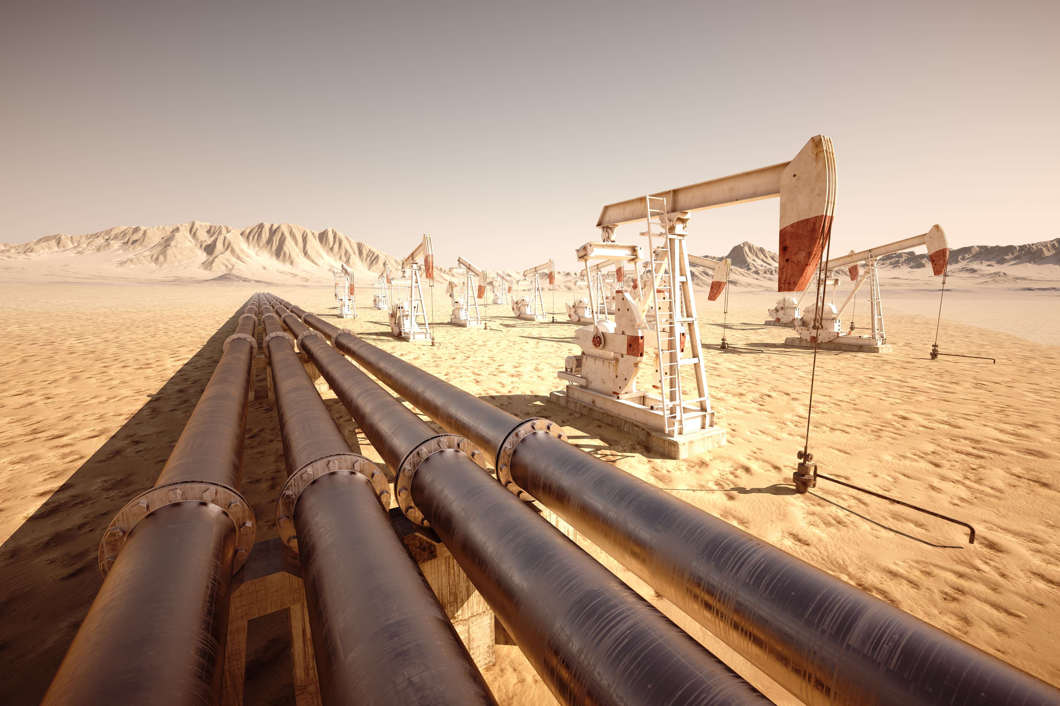 Four pipelines in the middle of a desert.