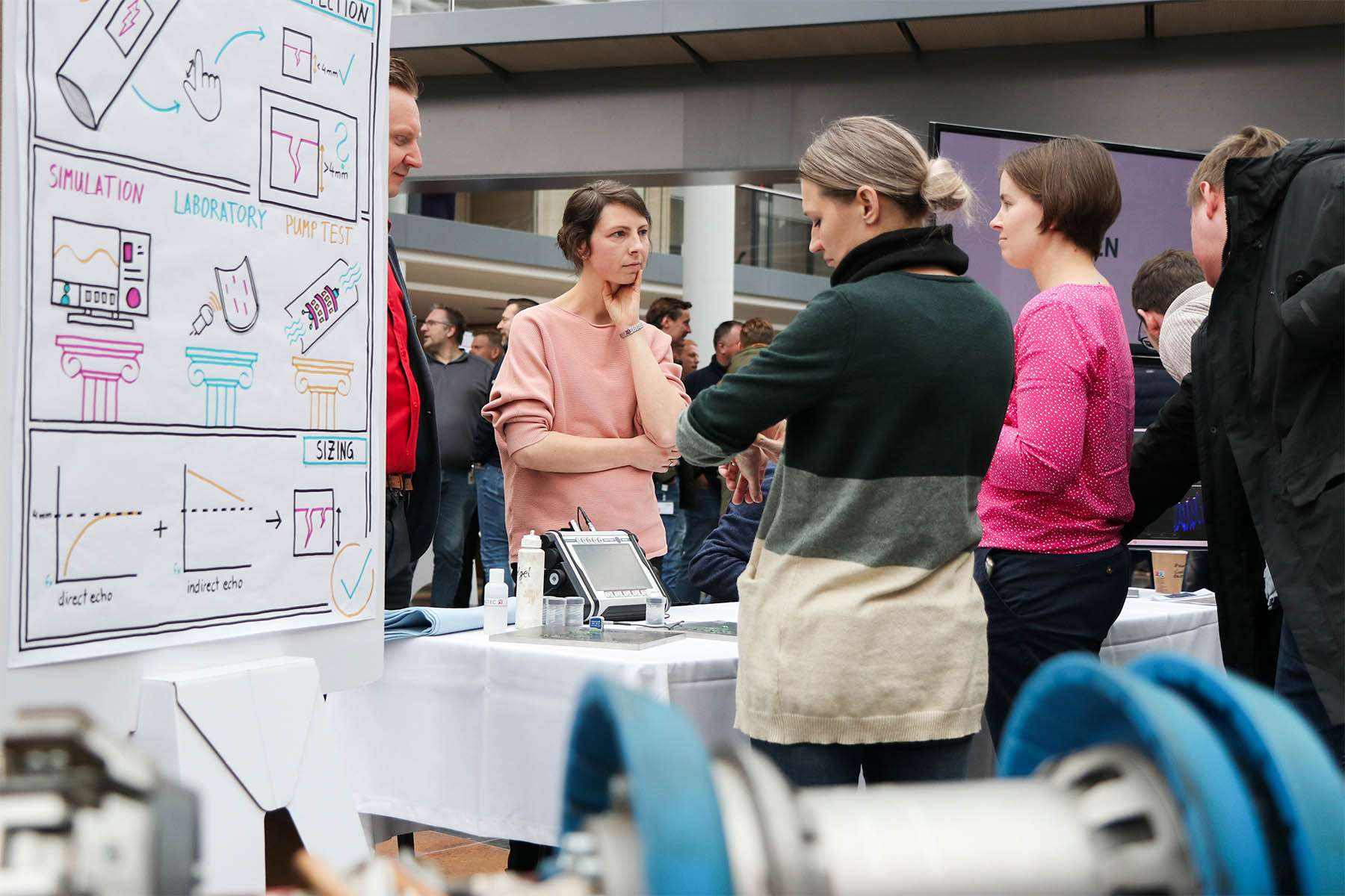 ROSEN employees standing at an exhibition table during the Creation Day 2024.