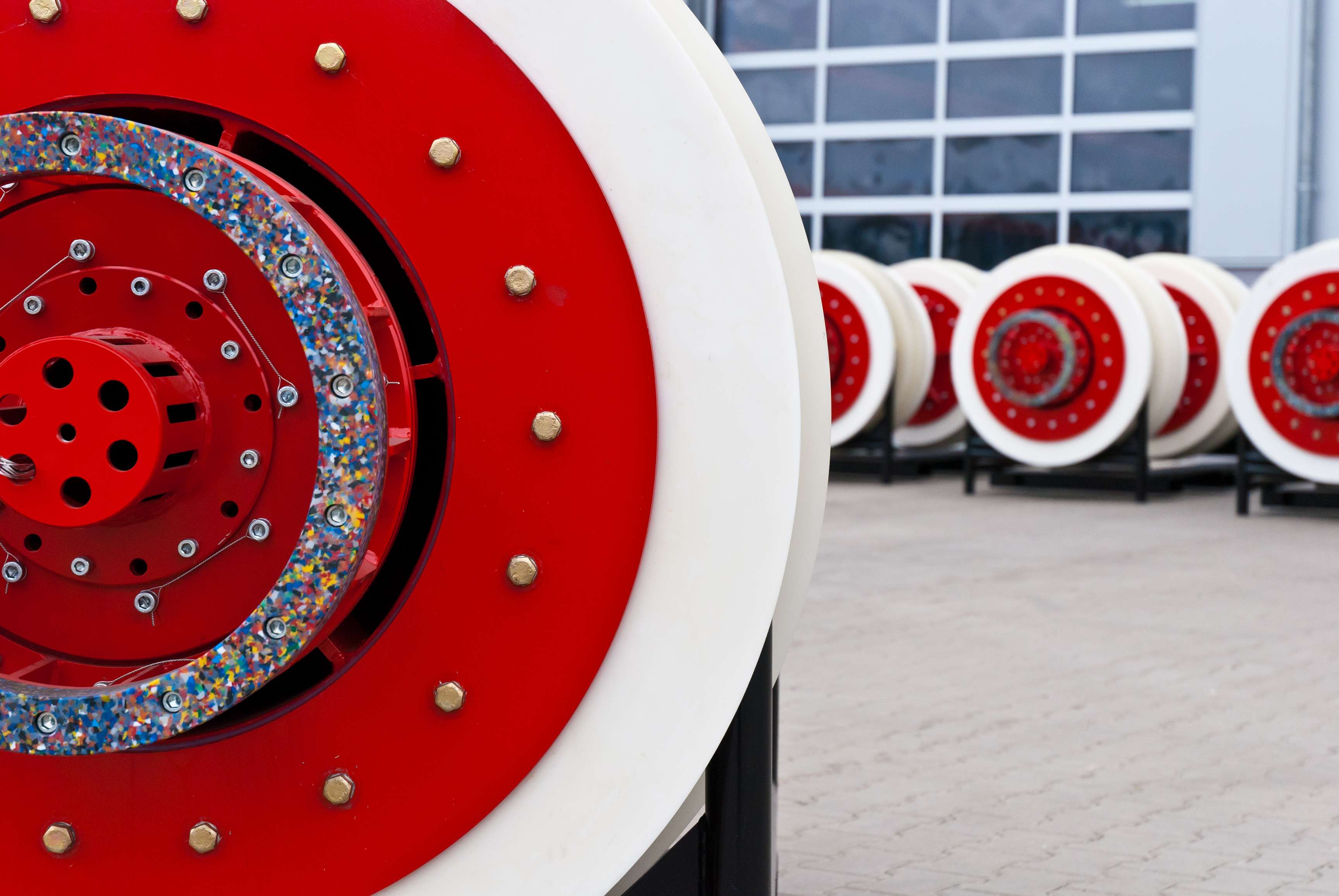 Close up of a cleaning tool with other blurry cleaning tools in the background.