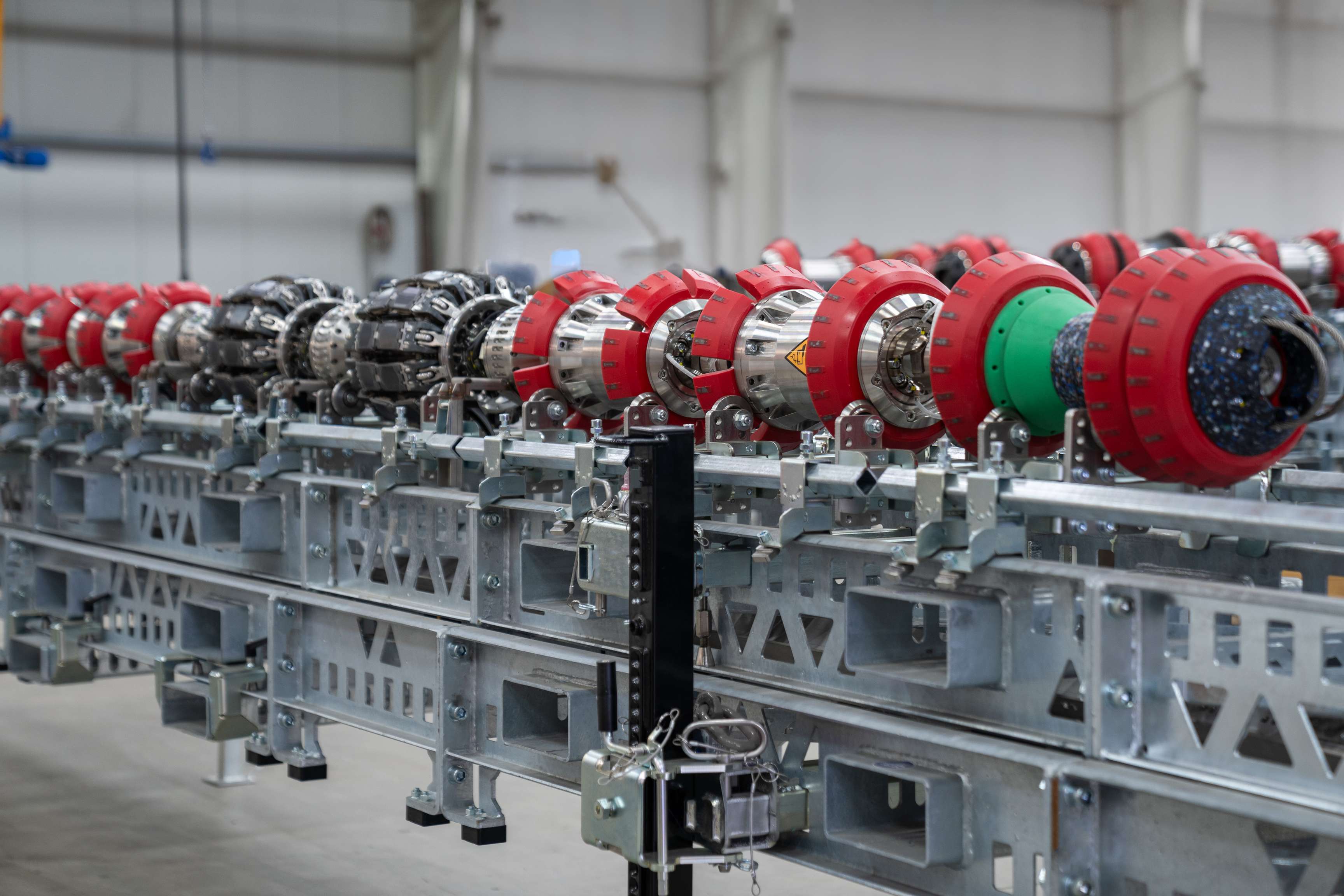 The ROSEN EMAT-C Ultra tool laying on a steel stand.
