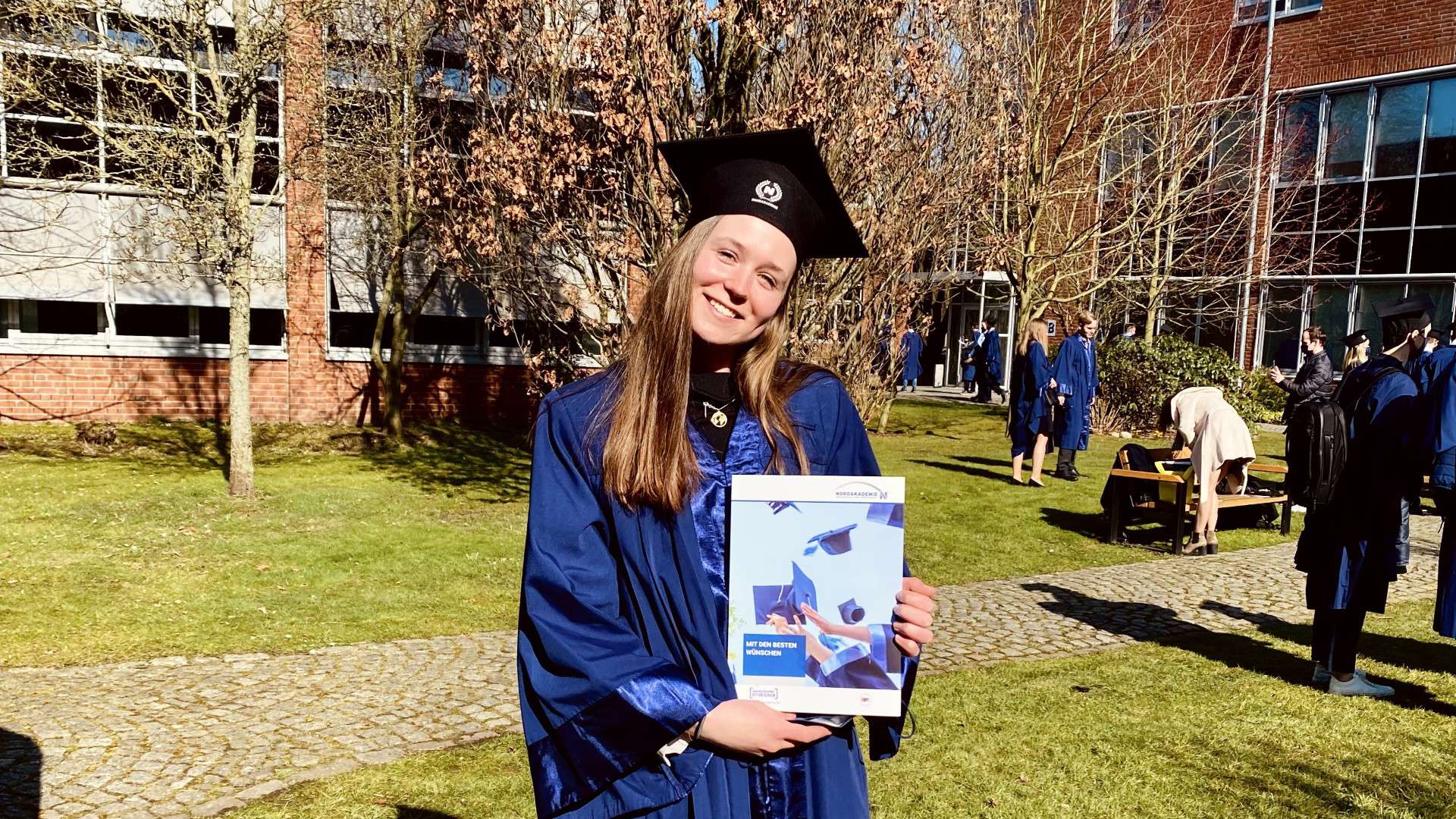Graduation photo of Rika Kleimann, from the ROSEN Group.