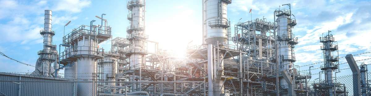 Close up Industrial view at oil refinery plant form industry zone with sunrise and cloudy sky.