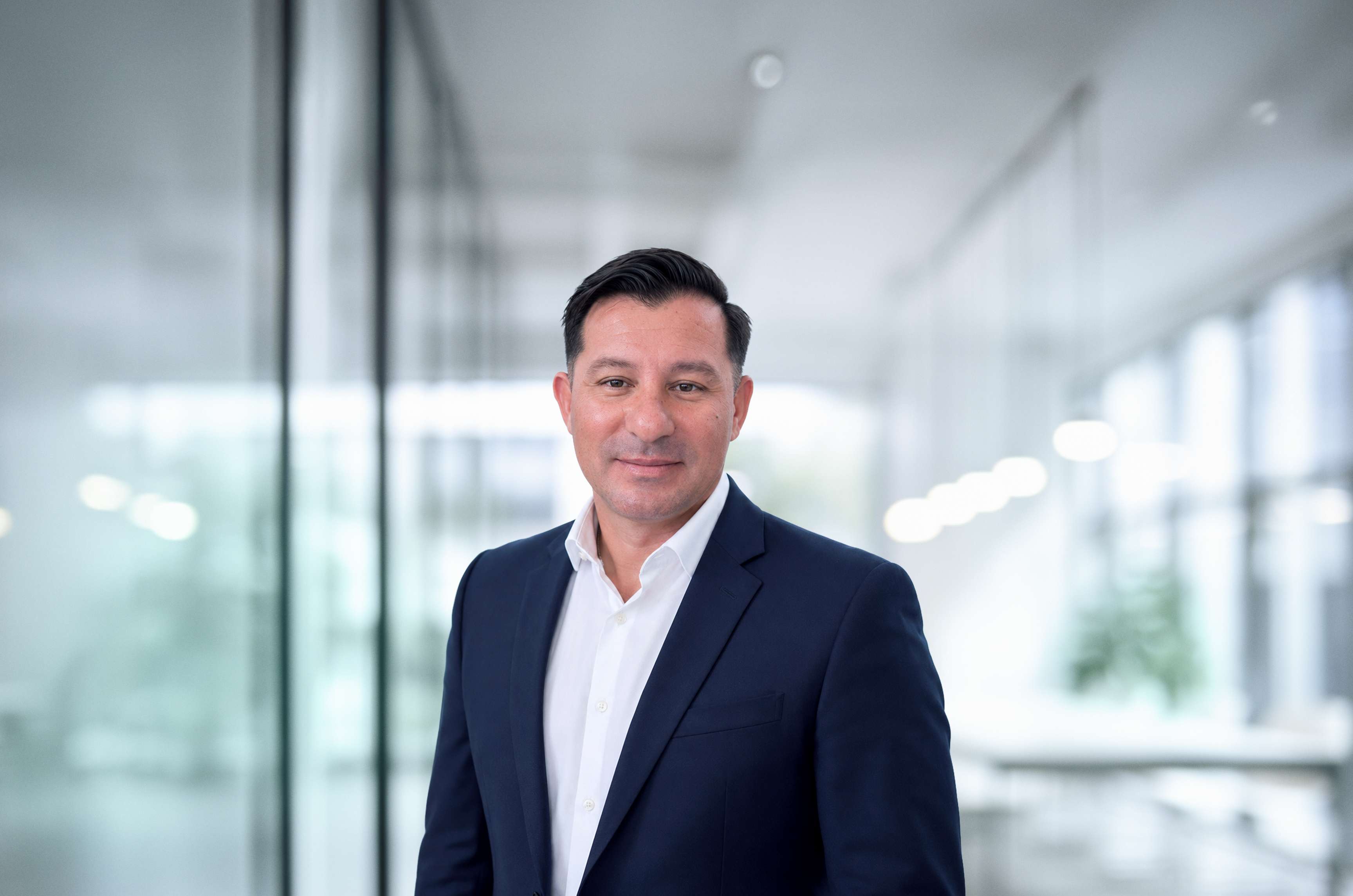 The image shows a portrait of Paul Madero, President of the Proficient Integrity Division.