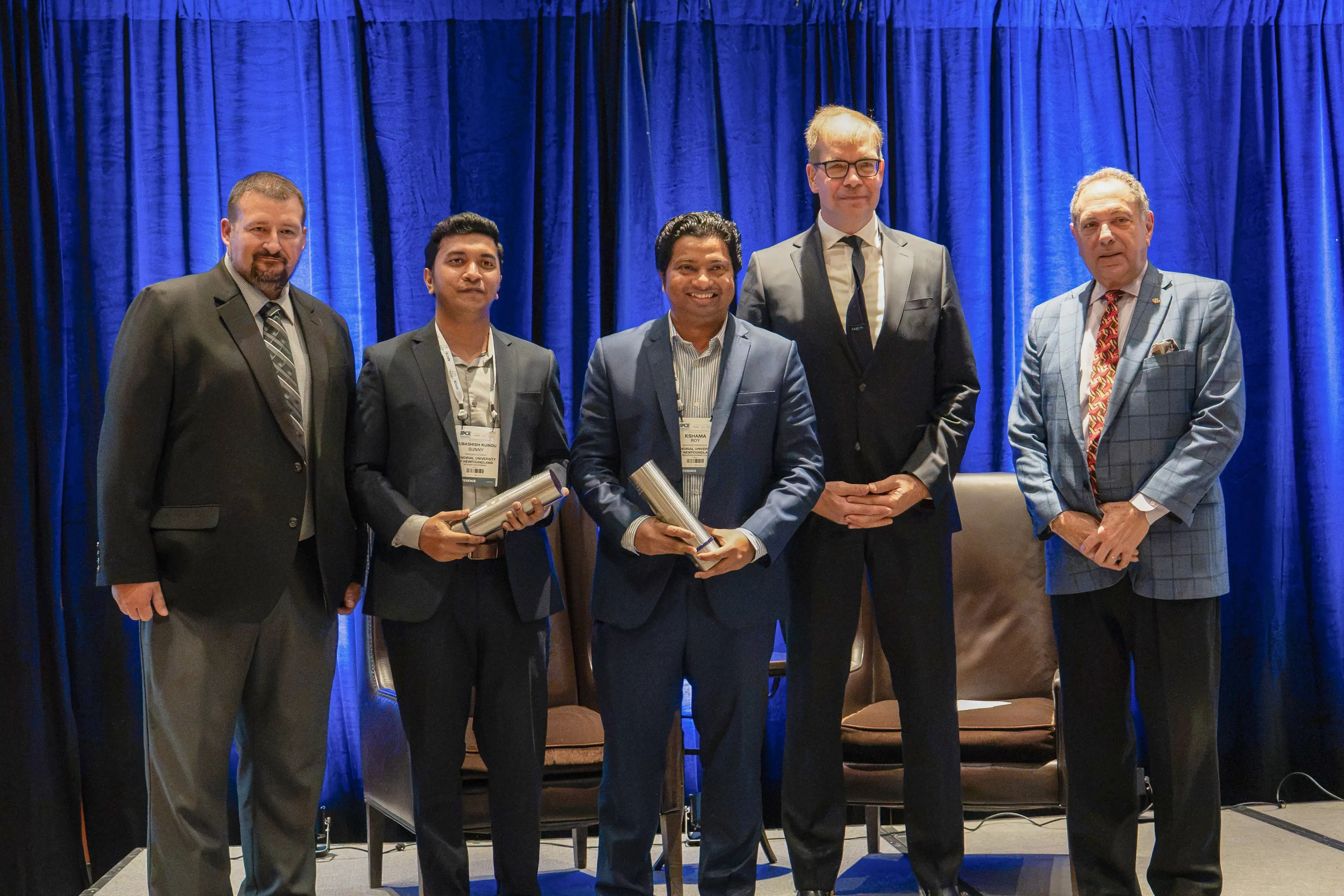 Andreas Opfermann (CEO, ROSEN), Tom Costabile (Executive Director/CEO, ASME) and Josh Wilson (2026 IPCE Organizing Committee, Honors and Recognition) with Dr. Kshama Roy and Subashish Kundu Sunny, winners of the 2026 Hermann Rosen Award for Pipeline Innovation