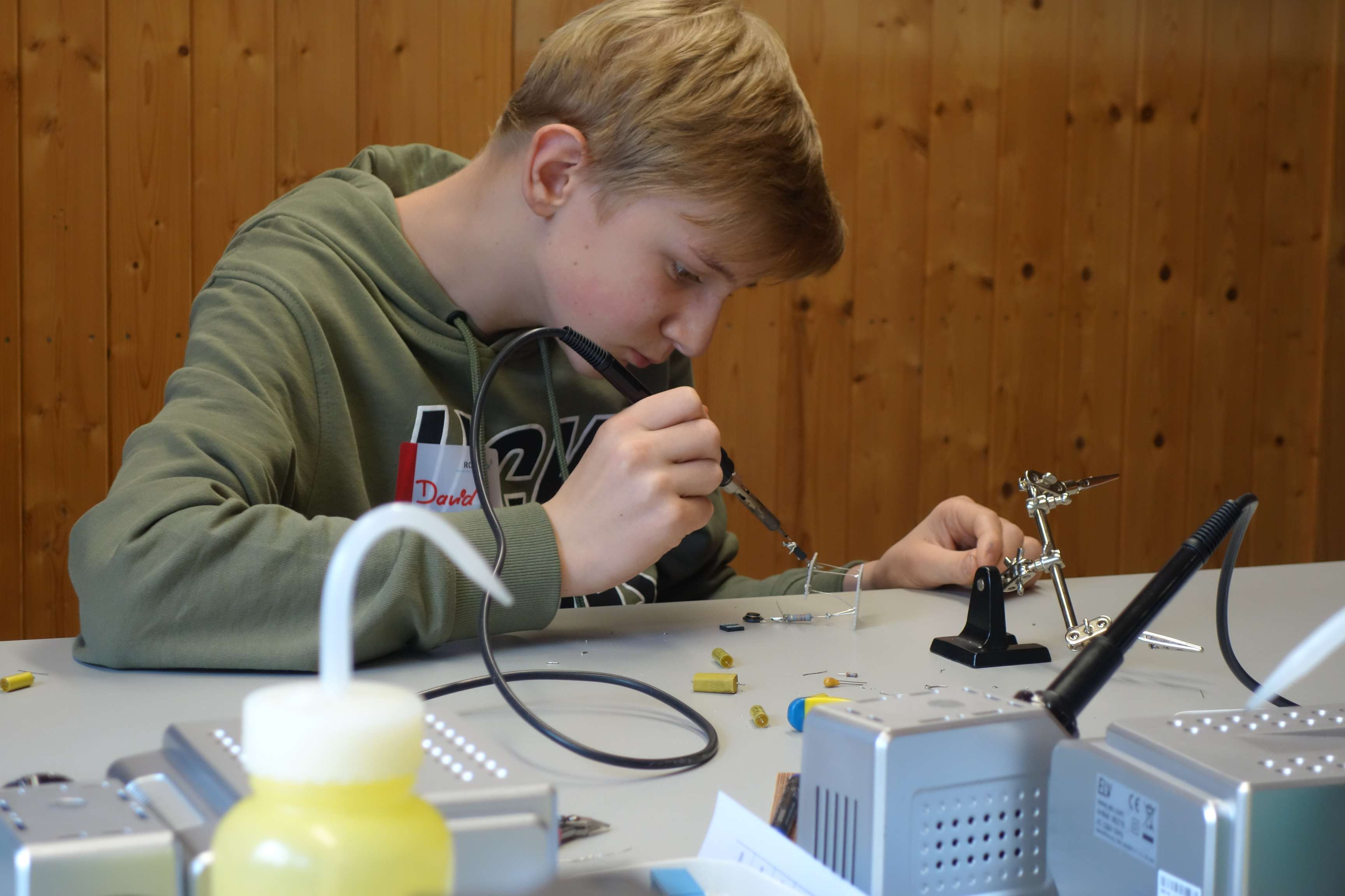 Student who is just learning how to solder