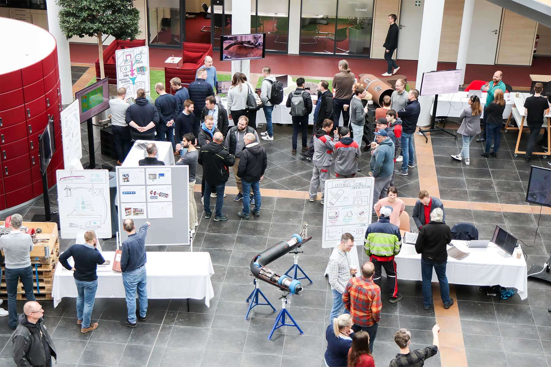 Bird's eye view of the Innovation Center with many ROSEN employees gathered around exhibition stands during the Creation Day 2024.