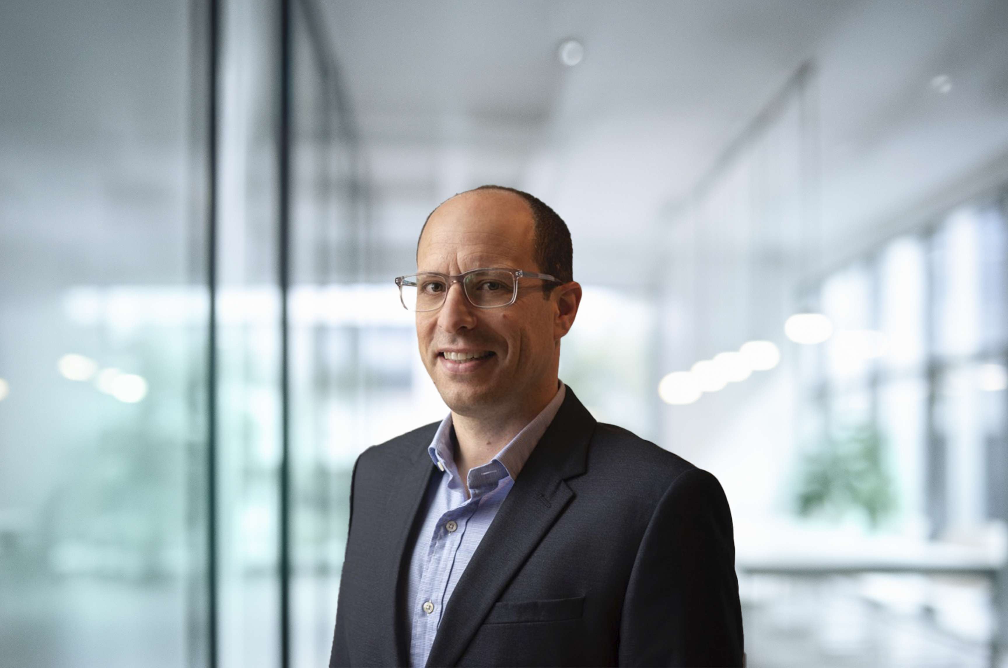 This image shows a portrait of Jeremy Berenzweig, the Chief Legal Officer of the ROSEN Group.