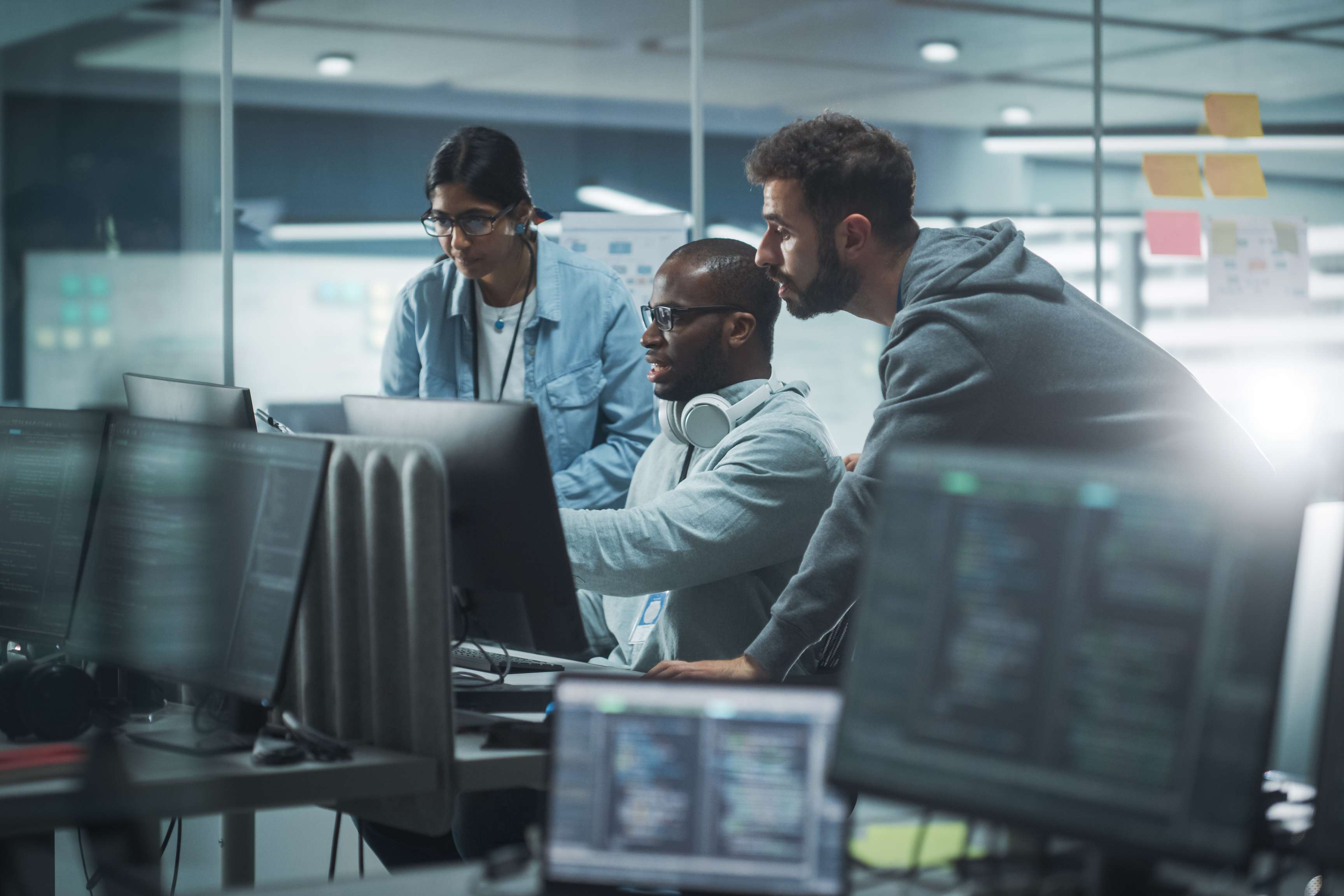 IT programmers brainstorming in a modern office.