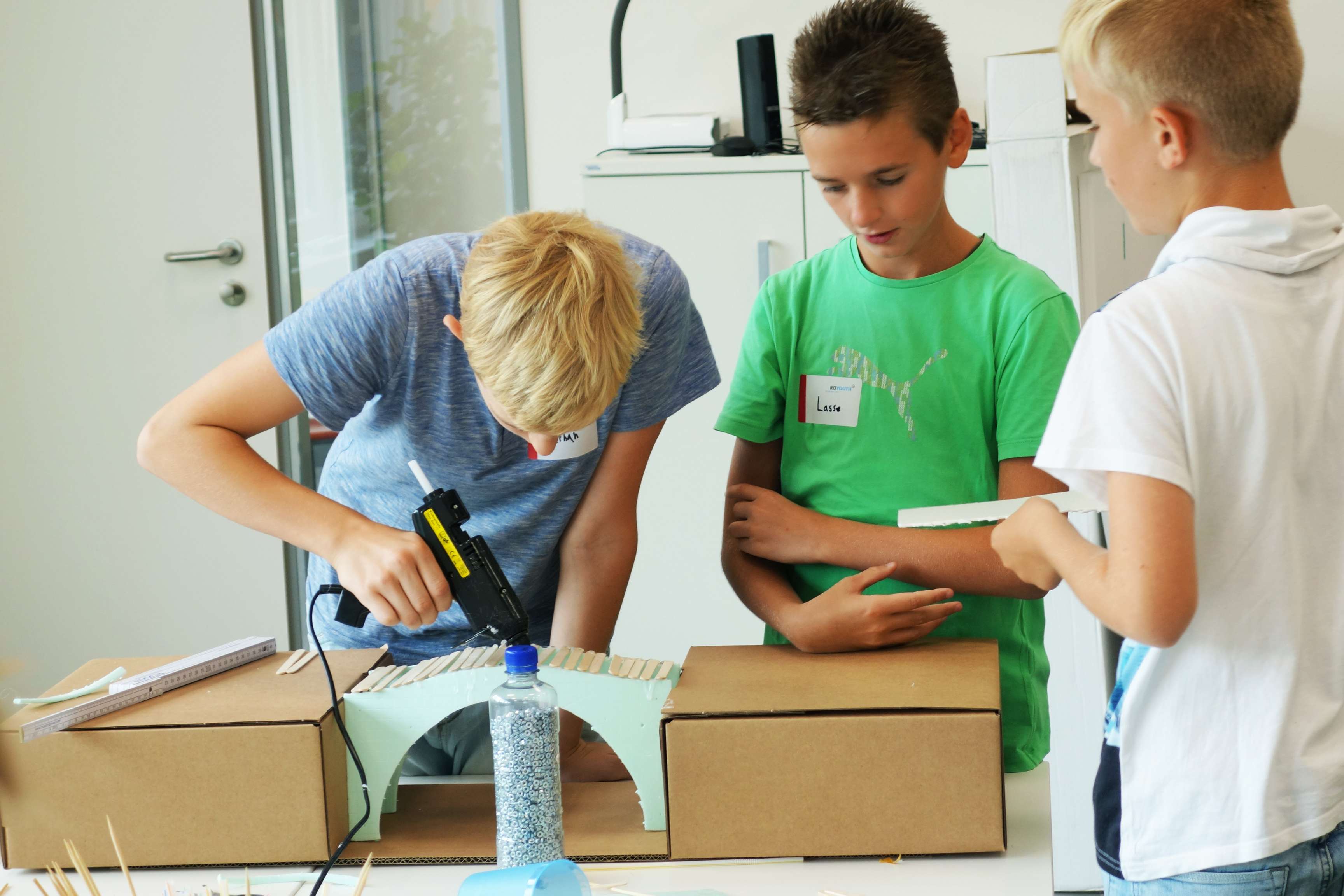 Three students give free rein to their creativity when building bridges